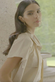 Vest with pocket and drawstring